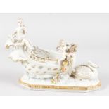 A DRESDEN STYLE PORCELAIN BOAT with swan and cupids.