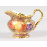 A ROYAL WORCESTER FRUIT PAINTED GADROON BORDERED CREAM JUG, signed by M. Tandy, black mark.