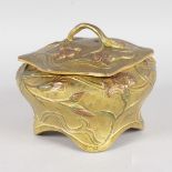AN ART NOUVEAU GILT BRONZE SHAPED BOX AND COVER with lift off lid, decorated with flowers and leaves