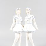 AN ART DECO DESIGN BLUE AND WHITE GROUP OF TWO GIRLS. 12ins high.
