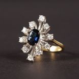 AN 18CT WHITE GOLD, SAPPHIRE AND DIAMOND CLUSTER RING.