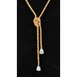 A 14CT YELLOW GOLD NECKLACE, set with two DIAMOND PENDANTS.