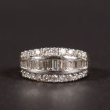 AN 18CT WHITE GOLD BAGUETTE SET DIAMOND RING.