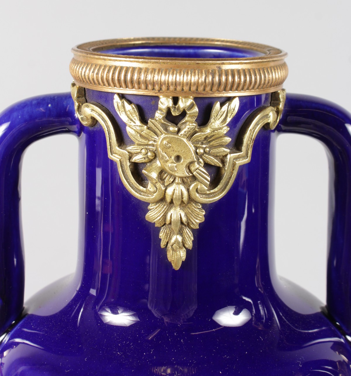 A GOOD PAIR OF SEVRES RICH BLUE PORCELAIN AND TWO HANDLED TAPERING VASES with gilt metal mounts - Image 2 of 7