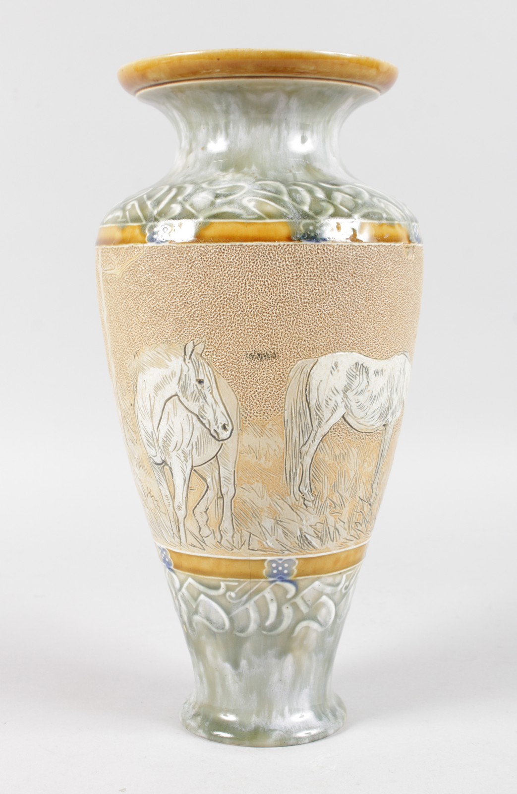 A DOULTON LAMBETH STONEWARE VASE, painted and incised decoration of four horses by HANNAH B. BARLOW.