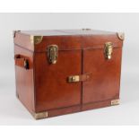 A GOOD LEATHER FOLDING FITTED HAMPER with brass locks and carrying handles. 17ins wide, 14ins high.