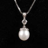 AN 18CT WHITE GOLD MOUNTED, PEARL AND DIAMOND PENDANT AND CHAIN.