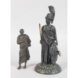 AFTER THE ANTIQUE, A BRONZE CENTURION on a circular base, 6ins high, and A SCHOLAR, 4ins high.