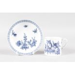 AN 18TH CENTURY MEISSEN BLUE AND WHITE CUP AND SAUCER.