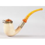 A GOOD PLAIN MEERSCHAUM AND AMBER PIPE with silver gilt band and lid. 7ins long, in a folding