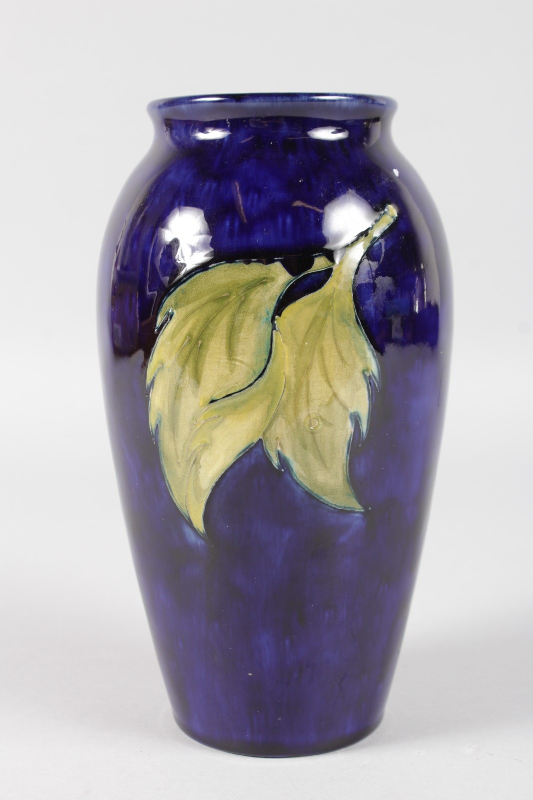 A MOORCROFT HIBISCUS PATTERNED VASE. Impressed MOORCROFT with printed label. 7.5ins high. - Image 3 of 6