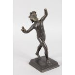 AFTER THE ANTIQUE THE BRONZE FAUN OF THE VATICAN, on a square base. 6ins high (hand missing).