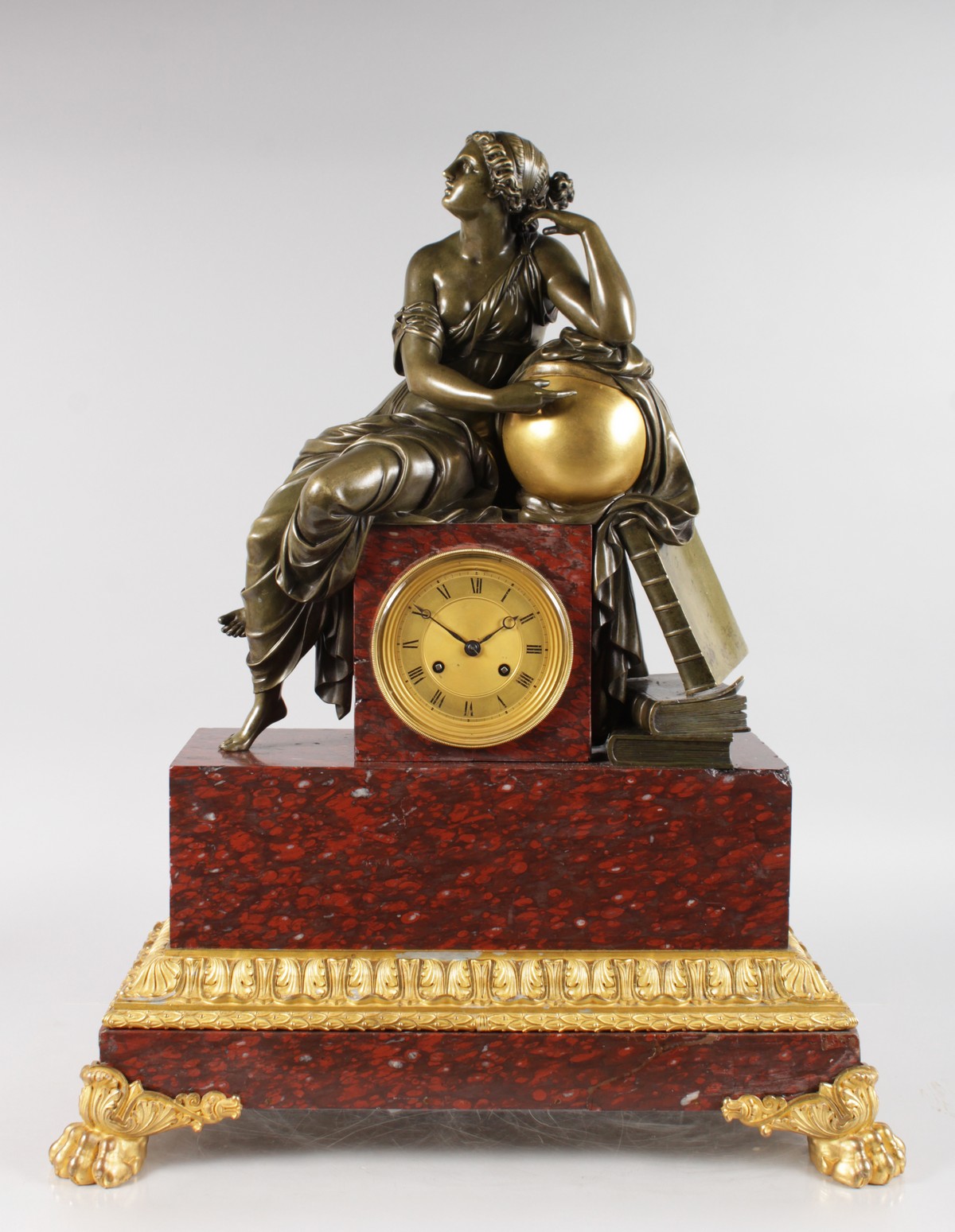 A SUPERB LOUIS XVI BRONZE, ORMOLU AND ROUGE MARBLE MANTLE CLOCK, the case with a classical female