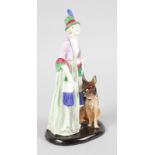 A RARE ROYAL DOULTON GROUP "IONA", an Alsatian dog at her side, Issued 1929-1938, Designed by L.