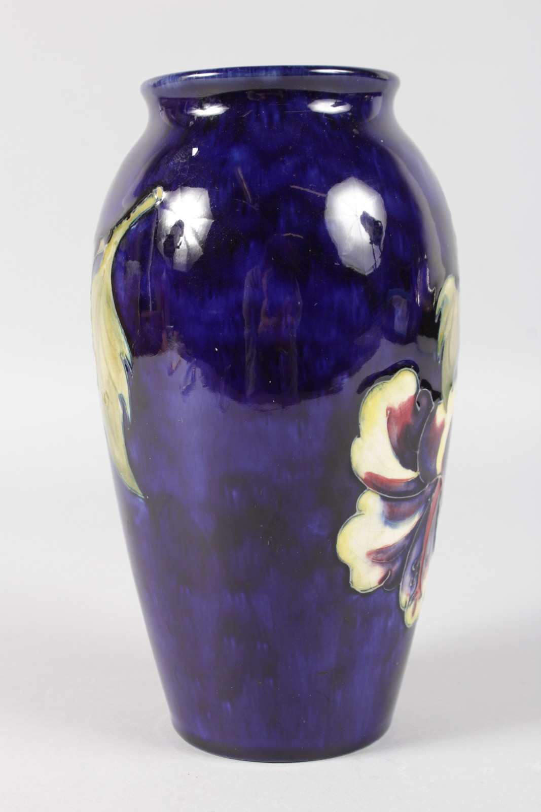 A MOORCROFT HIBISCUS PATTERNED VASE. Impressed MOORCROFT with printed label. 7.5ins high. - Image 2 of 6