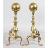 A GOOD PAIR OF 18TH-19TH CENTURY DUTCH BRASS ANDIRONS. 18.5ins high.