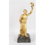 A CLASSICAL GILT BRONZE FIGURE, holding an eagle on a stepped marble base. 14ins high.