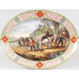 A SUPERB LARGE VIENNA OVAL DISH, with light blue and gilt border, the centre painted with men and