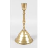 A 16TH CENTURY BRASS DOME CANDLESTICK. 9.5ins high.