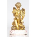 A GOOD 19TH CENTURY FRENCH GILT BRONZE SEATED WINGED CUP on a circular marble base. 5ins high.