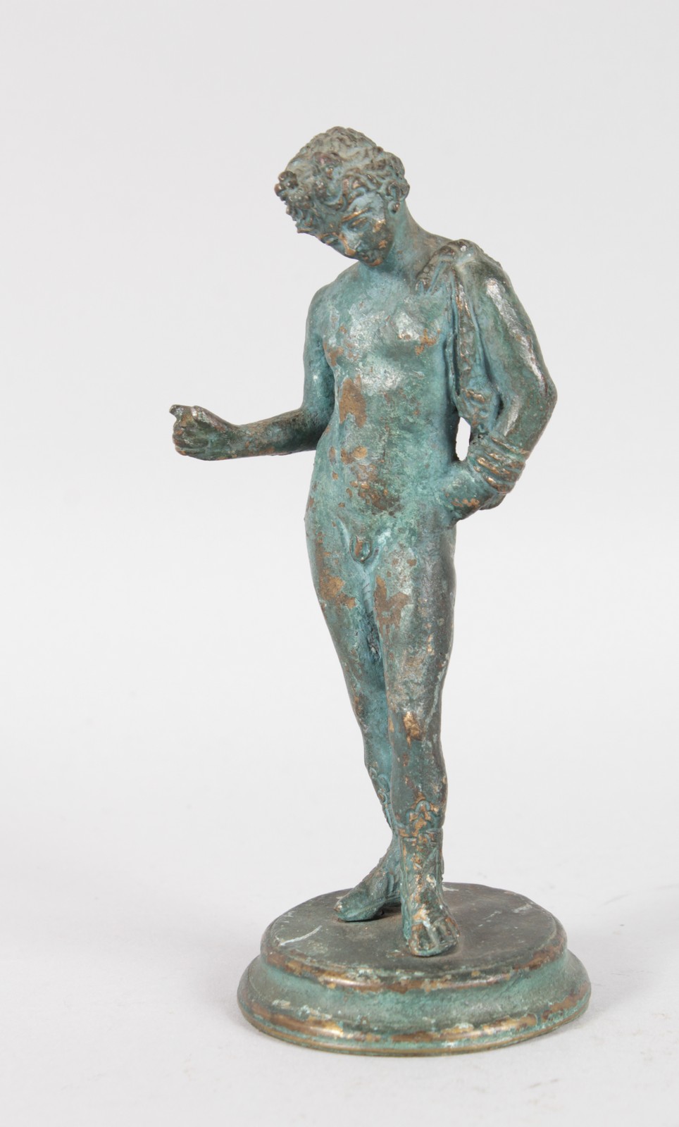AFTER THE ANTIQUE A STANDING NUDE CLASSICAL YOUNG BOY on a circular base. 5.5ins high.