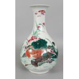 A FINE QUALITY 19TH CENTURY CHINESE FAMILLE ROSE PORCELAIN BOTTLE VASE, the sides of the pear-form