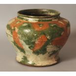 AN UNUSUAL CHINESE HAN STYLE GREEN & OCHRE GLAZED IRIDESCENT CERAMIC JAR, the base unglazed, 6.6wide