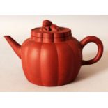 AN 18TH/19TH CENTURY CHINESE YIXING POTTERY TEAPOT & COVER, of lobed form, the cover with a