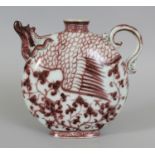 A CHINESE YUAN STYLE COPPER RED PHOENIX EWER, 7.8in long including handle and spout & 7.25in high.