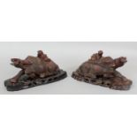 A MIRROR PAIR OF EARLY 20TH CENTURY CHINESE CARVED HARDWOOD WATER BUFFALO, together with fitted wood