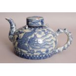 A CHINESE BLUE & WHITE PORCELAIN PHOENIX EWER & COVER, with a moulded bamboo handle, 7.7in long
