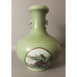 A LARGE GOOD QUALITY CHINESE CELADON GROUND FAMILLE ROSE PORCELAIN VASE, decorated with two circular