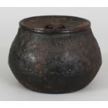 A 19TH/20TH CENTURY JAPANESE IRON JAR & COVER, the sides cast in relief with pine, 5.8in wide at