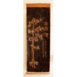 A CHINESE HANGING SCROLL PICTURE, decorated with calligraphy, seals and bamboo reserved on a black