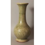 A GOOD CHINESE MING DYNASTY LONGQUAN CELADON VASE, the pear-form body incised beneath the glaze with