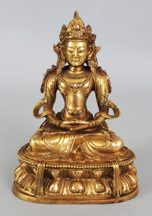 A GOOD QUALITY CHINESE GILT BRONZE FIGURE OF AMITAYUS BUDDHA, seated in dhyanasana on a double lotus