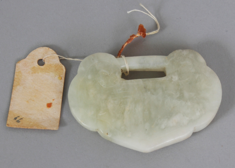 A 19TH/20TH CENTURY CHINESE RUYI FORM JADE PENDANT, with incised characters, 2.25in wide & 1.6in