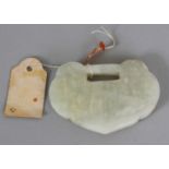 A 19TH/20TH CENTURY CHINESE RUYI FORM JADE PENDANT, with incised characters, 2.25in wide & 1.6in