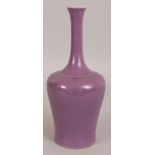 A CHINESE MONOCHROME PORCELAIN VASE, applied with an unusual purple-lilac glaze, the base with a