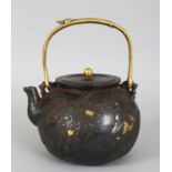 A SIGNED JAPANESE MEIJI PERIOD GILT IRON TETSUBIN, with matched cover and overhead swing handle, the
