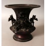 A 17TH CENTURY STYLE ORIENTAL BRONZE VASE, decorated in a Chinese style with children surrounding