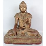 A VERY LARGE EARLY 20TH CENTURY BURMESE LACQUERED WOOD FIGURE OF BUDDHA, seated in dhyanasana, the