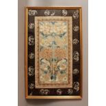 A PAIR OF 19TH/20TH CENTURY FRAMED CHINESE EMBROIDERED SILK SLEEVE PANELS, decorated in satin and