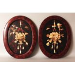 A PAIR OF EARLY 20TH CENTURY JAPANESE LACQUERED WOOD & BONE ONLAID OVAL PLAQUES, each decorated in