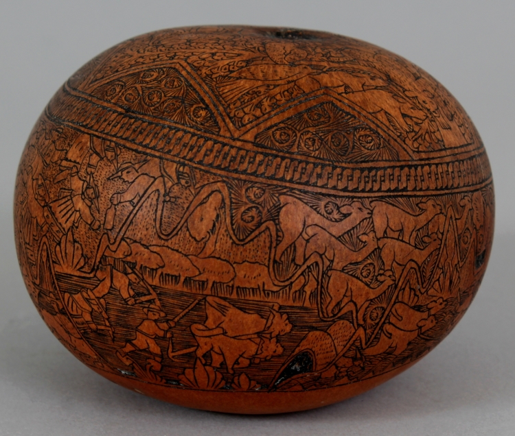 AN UNUSUAL 19TH CENTURY ENGRAVED PERSIAN GOURD, decorated in black engraving with elaborate detailed