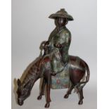 A 19TH CENTURY ORIENTAL CHAMPLEVE & BRONZE MODEL OF A SAGE, seated on a caparisoned horse and