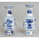 A SMALL PAIR OF CHINESE KANGXI PERIOD BLUE & WHITE PORCELAIN VASES, each painted with panels of '