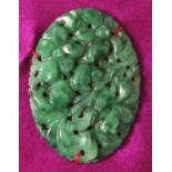 A SMALL FINE QUALITY 20TH CENTURY CHINESE CARVED & PIERCED SPINACH-GREEN JADE OVAL PLAQUE, mounted