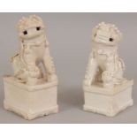 A NEAR PAIR OF 17TH/18TH CENTURY CHINESE DEHUA BLANC-DE-CHINE PORCELAIN MODELS OF BUDDHISTIC