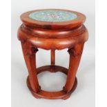 A 20TH CENTURY CHINESE CLOISONNE & CARVED HARDWOOD STAND, of barrel form, the top surface inlaid